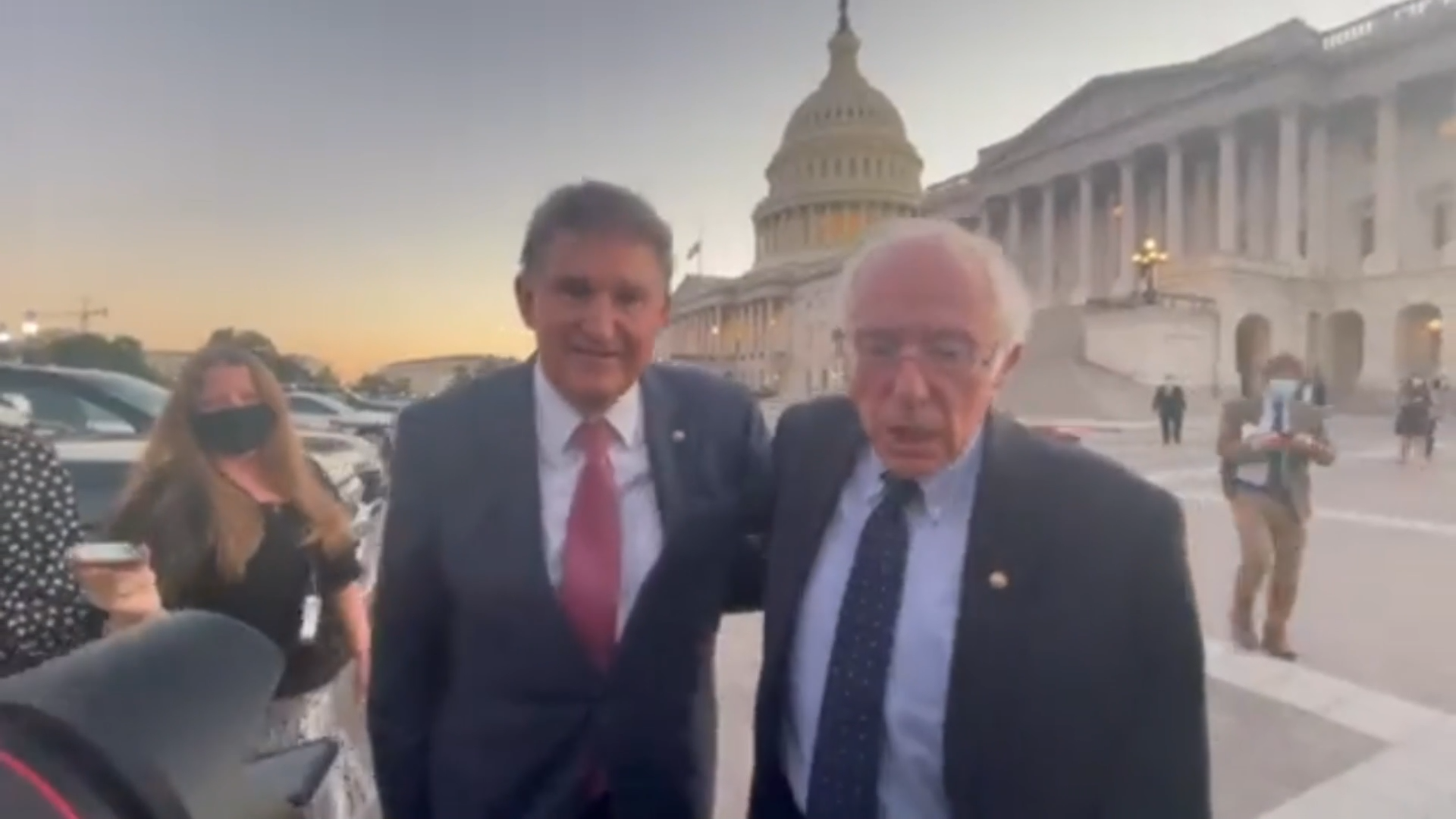 An Awkward Embrace Between Frenemies